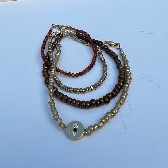 Gold and copper bangle bracelet set of 4 with evil eye charm - Picture 2 of 2
